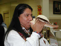 Louis playing the shell horn