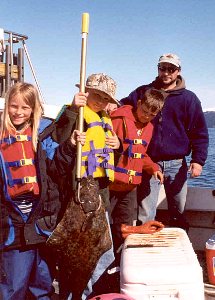 Kevin Gain and friends on a successful halibut fishing adventure